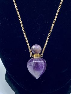 This Beautiful and Stylish Amethyst Crystal Bottle Necklace is made of raw natural Amethyst that has been beautifully carved into a Vial Necklace to hold perfume, Essential Oil, or Ashes.  This stunning & unique Amethyst Crystal Vial Necklace is a gorgeous statement piece!! This Bottle Necklace is a lovely piece to commemorate a loved one or beloved pet. Ashes can be safely & securely held in this Crystal Bottle Wear your loved one close to your heart to be reminded that they are always with you Lavender Necklace, Crystal Bottle, Streetwear Jewelry, Vial Necklace, Spiritual Necklace, Urn Necklace, Pet Ashes, Ashes Jewelry, Personal Aesthetic