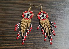 These beautiful Huichol Hand Beaded Fringe Earrings are sure to please. Perfect for that boho style or hippie jewelry. These earrings are for display only. Your earrings will be made to order in the colors of your choice. It usually takes 2-4 days to complete a pair of earrings, but Christmas rush may extend that time by a day or two. ❤ SIZE & DETAILS ♡ Hooks are 22k gold plated fish hook wire. (Hooks can be swapped between silvertone metal fish hook wires, silvertone clip-on or 22k gold plated Bohemian Beads With Bead Caps For Gifts, Hippie Beaded Jewelry For Crafting, Hippie Jewelry With Dangling Beads For Gift, Traditional Dangle Jewelry With Bead Caps, Beaded Earrings For Festivals, Red Bohemian Beads For Crafting, Adjustable Round Beaded Earrings For Festive Occasions, Traditional Gold Beaded Earrings As Gift, Unique Beaded Earrings With Tiny Beads For Festivals