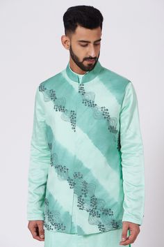 Tiffany blue bundi with floral embroidered motifs. Paired with pintuck detailed, asymmetric kurta and tapered-fit trousers.
Components:3
Embroidered
Neckline:Open 
Sleeve Length:Full
Fabric:Linen Silk
Color:Blue
Pintuck and asymmetric kurta
Embroidered bundi - Aza Fashions Jatin Malik, Kurta Set Men, Asymmetric Kurta, Kurta Set For Men, Embroidered Motifs, Nehru Jacket, Open Sleeve, Embroidered Neckline, Fitted Trousers