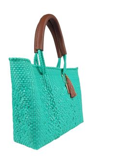 Experience the Mini Hannah Tote Bag- Teal, the perfect blend of style and sustainability. Handcrafted from recycled plastic, this chic and compact tote allows you to carry your essentials with ease while reducing your carbon footprint. Green Straw Bag With Braided Handles, Green Straw Bag With Braided Top Handles, Rectangular Woven Leather Beach Bag For Shopping, Chic Green Rectangular Beach Bag, Chic Green Woven Straw Bag, Green Crochet Bag With Double Handle, Trendy Green Handwoven Shoulder Bag, Green Handwoven Crochet Bag For Shopping, Green Handwoven Crochet Shopping Bag