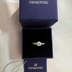 Swarovski Crystal Attract Ring Size 5.5. Brand New With Tag. Offers Welcome! See Our Photos For Details. Item #05759862 From Swarovski, This Ring Features: Swarovski's Attract Round Ring Is A Truly Romantic Gift. This Stunning, Rhodium-Plated Ring Features A Round Crystal In The Center With Sparkling Crystals On Either Side. The Crystals Embellish The Front Half Of The Ring. The Perfect Jewelry Piece For Day Or Evening Outfits! Rhodium-Plated Metal Swarovski Crystal Swarovski Promise Ring, Swarovski Ring Aesthetic, Dainty Wedding Ring Silver, Swarovski Ring Engagement, Swarovski Jewelry Aesthetic, Swarovski Rings, Girlfriend Proposal, Graduation Ring, Swarovski Jewelry Rings