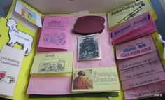 there are many books on the table with pink and yellow paper covering them, including children's literature