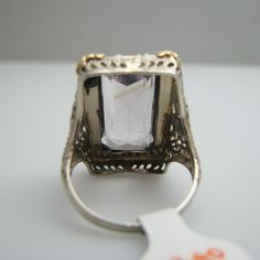 "For sale: (1) d840 14k White Gold Amethyst Seed Pearl Ring PLEASE READ ENTIRE DESCRIPTION BEFORE PURCHASING Pre-owned item. Good condition. Please see pictures for details. Sold as is, as seen on pictures. This ring contains one large amethyst and 41 seed pearls. It is not stamped, but has been tested for authenticity. Specifics: 14k White gold Size: 7 (U.S.) Stone Dimensions: 20 mm x 10 mm Width: 24.3 mm Total Weight: 6.9 grams Please be 100% sure of your purchase before buying, as we do not o Formal 14k Gold Amethyst Ring, Formal Amethyst Ring In 14k Gold, Formal 14k Gold Amethyst Gemstone Ring, Emerald Cut Amethyst Ring For Formal Occasions, Luxury Emerald-cut Amethyst Ring For Formal Events, Luxury Emerald Cut Amethyst Ring For Formal Occasions, Art Deco Amethyst Ring In Yellow Gold, Rectangular Amethyst Ring In Yellow Gold, Vintage Emerald-cut Amethyst Ring For Anniversary