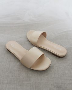 Classic slide flat sandals for casual and dressy look. Simple and easy wear for brides, bridesmaids and wedding parties.DETAILS:COLORS AVAILABLE: Ivory, Light Blue, White, Pink, and ChampagneUPPER: Synthetic upper and liningMATERIALS: Mandmade outsole STYLE NAME: EVELYN Elegant Beige Flats For Summer, Chic Wedding Sandals For Summer, Flat Heel Slides For Summer Parties, Chic Summer Sandals For Wedding Guest, Summer Party Slides With Flat Heel, Chic Sandals For Wedding Guest In Summer, Beige Summer Formal Flats, Formal Summer Beige Flats, Formal Beige Summer Flats