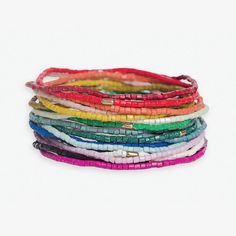 For the free-spirited fashionista who craves a kaleidoscope of color and texture, we present the Chelsea 18 Strand Luxe Beaded Stretch Bracelet Set. This showstopping stack is a true celebration of unrestrained bohemian style and artisanal craftsmanship. Featuring a mesmerizing array of 18 individual bracelets in eye-catching multicolored beads, the Chelsea set instantly energizes any look with its bold, eclectic blend of hues. But these aren't just basic beaded bangles - oh no. Every bracelet is meticulously hand-strung by skilled artisans, resulting in miniature works of wearable art designed to highlight your fierce, individualistic flair. The stretch fit allows each strand to hug your wrist with comfortable ease as you dance through life's vibrant adventures. Whether you're making a st Hippie Multicolor Beaded Wrap Bracelet, Multicolor Tiny Beads Bangle, Colorful Bohemian Faceted Beads, Multicolor Multi-strand Friendship Bracelets For Beach, Multicolor Stackable Beaded Bracelets For Beach, Multicolor Spacer Beads Wrap Bangle Bracelet, Adjustable Multicolor Friendship Bracelets With Faceted Beads, Multicolor Spacer Beads Wrap Bracelet, Multicolor Stackable Stretch Bracelet For Festivals