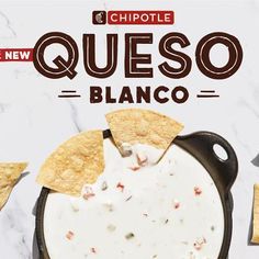 the chipotle queso is being served in a skillet with tortilla chips