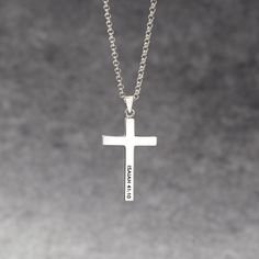 "Modern cross necklace for men. This shiny sterling silver cross jewelry with a name and/or bible verse on is the perfect necklace for the man of faith. P R O D U C T ∙ I N F O * Material: Pendant is 100% sterling silver. * Finishing: Silver - Yellow Gold. * Word limits: 15 characters. * The cross measures approximately 13/16''x 1 3/16'' (20x30mm). H O W ∙ T O ∙ P E R S O N A L I Z E STEP 1: Choose what you want at the drop-down options. STEP 2: Leave your instruction in \"Add your personalizati Christian Jewelry For Men, Personalized Silver Cross Necklace, Cross Pendant For Men, Minimalist Personalized Cross Pendant Necklace, Silver Cross Necklaces With Name Detail, Silver Name Necklace With Cross Shape, Sterling Silver Cross Necklace For Baptism, Father's Day Silver Cross Pendant Necklace, Silver Cross Pendant Necklace For Father's Day