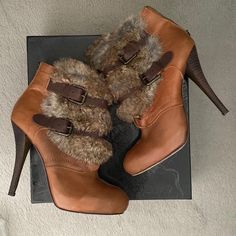 Great Condition Leather Heeled Boots With 4-inch Heel For Winter, Winter Closed Toe Leather Heels, Brown Ankle Strap Heels For Fall, Winter Leather Closed Toe Heels, Chic Brown Heeled Boots With Buckle Closure, Brown Heels With Buckle Closure For Fall, Brown Heels With Buckle Closure And Round Toe, Brown Pointed Toe Heels For Winter, Brown Leather Heeled Boots With Buckle