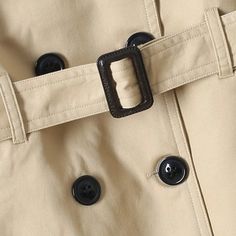 Made from 100% organic cotton, this trench coat features an eco-friendly, breathable, and hypoallergenic material. To maintain its quality, simply machine wash on low or delicate, and dry gently on low heat. It's the perfect gift for any occasion, making every day special for the little one in your life. Double-breasted Cotton Outerwear, Classic Double-breasted Cotton Outerwear, Cotton Long Coat With Double Button Closure, Classic Cotton Outerwear With Double Button Closure, Beige Double-breasted Cotton Outerwear, Fall Cotton Raincoat For Workwear, Fall Cotton Raincoat For Work, Cotton Raincoat For Workwear In Fall, Belted Beige Cotton Outerwear