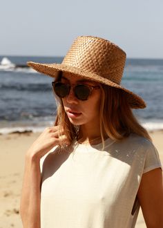 Our Catalina is a short-brim straw hat featuring a woven trim, a perfect sunny-weather staple. Ideal for those long days of sunlight featuring afternoons picnics and everything in-between. Lightweight Made from Straw *Sizes vary but measure about S/M: 21 IN M/L: 23 IN Spring Coastal Boater Hat Made Of Toquilla Straw, Summer Fedora Panama Hat Made Of Palm Leaf, Lightweight Straw Hat For Day Out, Lightweight Beachy Panama Fedora Hat, Upf 50+ Curved Brim Hat For Picnic, Chic Natural Straw Hat With Upf 50+, Curved Brim Sun Hat With Upf 50+ For Picnic, Natural Woven Fedora, Bohemian Fedora Straw Hat For Warm Weather