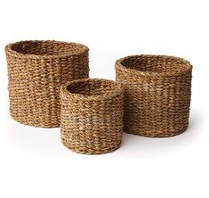 three woven baskets sitting next to each other