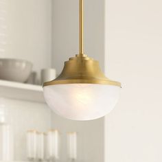 a light hanging from the ceiling in a kitchen