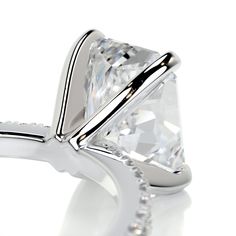 This is why radiant cuts are so popular! They give the most modern twist to classic rectangular cuts.Here is our 2.3-ctw radiant F VS2 engagement ring finished with a band of icy white diamonds.This has her name all over it.2 Carat Radiant F VS2 Diamond with an additional of 0.3 Carat Diamonds on the sides. This Ring is Certified by a Third Party Gemological institute 3 Carat Ring, Special Engagement Ring, Timeless Engagement Ring, 3 Carat Diamond, Measure Ring Size, Vs2 Diamond, Pave Engagement Ring, Types Of Diamonds, Engagement Rings Platinum