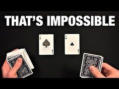 two hands holding playing cards with the words that's impossible