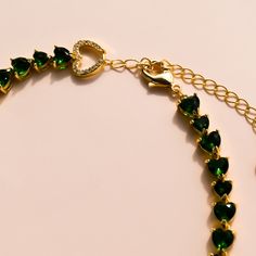 The Heart Emerald Necklace is a stunner! The vibrant heart shaped emeralds are unique and timeless. The rich green tone of the emeralds are complemented by the graduated heart shaped stones. Wear this stunning necklace solo or with others for an elevated look. 16-18 inches Green Heart-shaped Jewelry For Party, Green Heart-shaped Party Jewelry, Green Emerald Heart Pendant Necklace, Elegant Green Emerald Heart Pendant Necklace, Elegant Heart-shaped Green Emerald Necklace, Elegant Green Heart-shaped Emerald Necklace, Green Emerald Heart-shaped Necklace, Green Emerald Heart Necklace, Green Heart-shaped Emerald Necklace