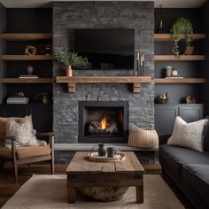 a living room filled with furniture and a fire place