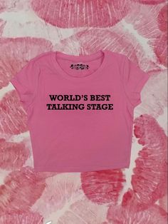 "Crop top with \"Worlds Best Talking Stage\" - design printed on a 95% cotton 5% spandex, form fitting, available in multiple colors 💞 Make sure to check the size chart!✨ Message me with any questions :)  we do not give refunds for incorrect addresses so please double check that all your information is correct before ordering" Fitted Basic T-shirt With Funny Print, Y2k Cropped T-shirt With Letter Print For Spring, 90s Slogan Cotton T-shirt, Cute Short Sleeve Stretch Tops, Cute Stretch Short Sleeve Tops, Cute Fitted Cropped T-shirt For Streetwear, Fitted 90s Style Crop Top T-shirt, Pink Stretch T-shirt With Text Print, Pink Text Print Cropped T-shirt With Crew Neck