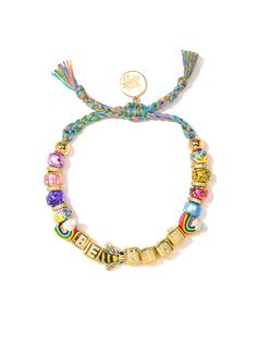 This Be Nice Bracelet is more than just a fashion statement - it's an attitude adjustment! Bright rainbow tie dye threadwork and glass charms shimmer in the light, while pave rhinestone accents and ceramic charms add a bit of extra shine. Make every day a little brighter in style! 6" Adjustable rainbow threadwork Drawstring closure (extendable up to 8") Gold plated brass hardware Glass charms Pave rhinestone charms Ceramic charms Handmade in New York City and Puerto Rico. Due to the handmade nat Adjustable Multicolor Jewelry With Removable Charms, Ceramic Charms, Attitude Adjustment, Rainbow Tie Dye, Bright Rainbow, Daith Piercing, Rainbow Tie, Arm Party, Glass Charms