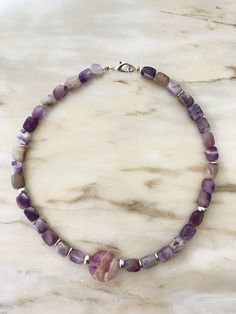 A necklace made of natural stone suitable for holidays and everyday wear, for office and concert, a gift for mom, sister, or a friend for their birthday, wedding day, Christmas, or Valentine's Day. A personalized meaningful gift based on the zodiac sign and moon phase. A Fluorite charm, 0.88 ounces in size, supports fluorite 6mm beads and hematite inlays. Steel hardware, lobster clasp. Lithotherapy. Lavender Gemstone Beaded Necklaces As Gift, Lavender Gemstone Beaded Necklaces For Gift, Lavender Gemstone Beads Necklace For Gift, Polished Tumbled Bead Necklaces As Gifts, Tumbled Polished Bead Necklaces For Gifts, Handmade Tumbled Beaded Necklaces As Gifts, Handmade Tumbled Beaded Necklaces For Gifts, Purple Hand-strung Necklace As Gift, Tumbled Polished Beads Necklace For Gifts