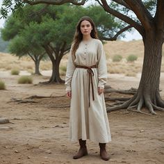 This beige Viking-inspired tunic dress offers a blend of simplicity and historical elegance, perfect for medieval reenactments, Renaissance fairs, or Viking festivals. The buttoned front and brown belt create a classic and authentic look, while the natural tones add to the rustic charm. Ideal for both outdoor festivals and historical events, this dress provides a comfortable fit with a timeless design. Whether you're looking to step back in time or make a statement at a themed event, this Viking tunic dress offers both style and practicality, capturing the essence of Nordic history. I hope you will love my design as much as I enjoyed creating it for you! ----Important Information---- Please, be aware that all pictures are designer's illustrations. The actual product may slightly differ in Warrior Dress, Viking Tunic, Festival Costumes, Brown Belt, Medieval Dress, Have A Great Day, Tunic Dress, Dress Clothes For Women, Vikings