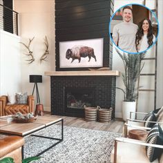 a living room filled with furniture and a fire place in front of a painting on the wall