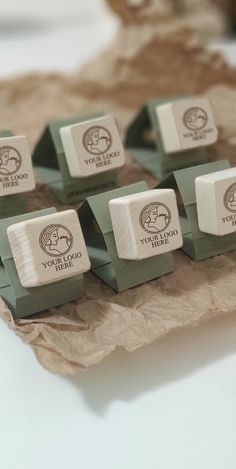 several small wooden blocks with logos on them