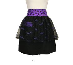 a black and purple skirt with flowers on it