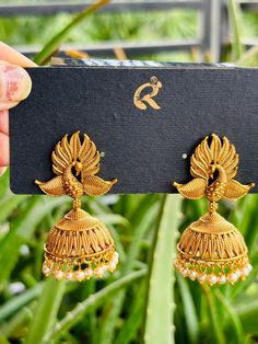 A perfect pair of gold jhumke in peacock motif 🦚 Traditional design with pastel  gold carvings  to add to the uniqueness of this beautiful earrings Add this jhumka to your collection for an ethnic event you want to slay at Can be adorn for an Indian wedding sangeet mehndi party ethnic function Diwali or Eid It's a perfect gift for a loved one who loves jewelry and will cherish it with great memories  For any order related queries, connect with us over a DM and it will be taken care of immediate Gold Jhumka, Peacock Motif, Gold Jhumka Earrings, Mehndi Party, Jhumka Earrings, Earrings Vintage, Great Memories, Designer Earrings, Diwali