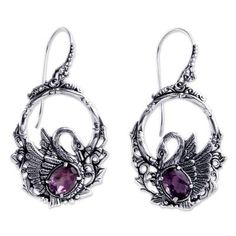 Faceted amethysts sparkle in finely detailed earrings by Kadek Hendra. Depicting graceful swans the ornate design showcases 3 gemstone carats. .925 Sterling silver Silver Swan, Ornate Design, Bird Earrings, Electronics Jewelry, Jewelry Online Shopping, Swans, Jewelry Packaging, Showcase Design, Hook Earrings