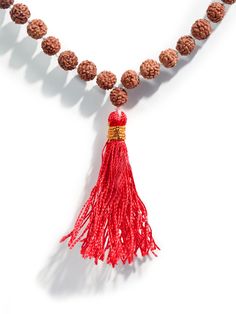 This set of Prayer Beads, a Mala or Rosary, is made of finely selected, peppercorn sized, five Mukhi Rudraksha mala beads. Thread-knotted in traditional style with red tassel, this Rudraksha rosary is best for doing Japa or chanting mantras to all deities. You may keep the healing mala in your puja altar for positive vibrations or as a garland for your deity idol. You may also wear it around your neck. It is best to avoid wearing this with other Rudraksha combinations. Measures 34 inches long wh Hand-strung Beaded Necklaces As Festival Gifts, Festive Hand-strung Beaded Necklaces As Gifts, Spiritual Gemstone Beads Mala For Puja, Spiritual Gemstone Mala For Puja, Hand-strung Spiritual Mala For Puja, 8mm Beaded Mala For Festivals And Gifts, Mala With 8mm Beads As Festival Gift, Spiritual Beaded Necklaces With Polished Beads For Festivals, Traditional Ritual Gemstone Beaded Necklaces