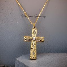 High Quality Gold Plated Hawaiian Heirloom Cross CZ Pendant with Necklace. The gold plated necklace measures 21 inches with a 3 inch extender attached for your adjustment. You can easily adjust the necklace to your fitting up to 24 inches in length. The Gold chains are solid and sturdy and very durable. Gold Cross Jewelry With Adjustable Chain, Gold Cross Jewelry For Wedding, Gold Cross Pendant Jewelry Gift, Gold Cross Necklace With Adjustable Chain As Gift, Gold Cross Pendant Necklace For Gift, Gold Cross Necklace Ideal For Gifts, Gold Jewelry With 16 Inch Chain As Gift, Gold Cross Necklaces For Jewelry Making, Gold Plated Cross Pendant Necklace For Anniversary