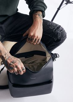 Stevie Midi is gender-neutral, edgy, and has the space to hold just the essentials. From a hike to the store, from work to the park, her eight internal pockets and easy-to-clean microfiber vegan leather make her the perfect bag to take just about anywhere. This ‘just right size’ is ideal for the mama who’s ready to downsize, and who likes nice things yet doesn’t want to fear the rough & tumble. Stevie’s all about options – her backpack converts to a shoulder strap, and her intuitive internal org Stroller Hooks, Everyday Backpack, Matte Black Hardware, Gear Bag, Hospital Bag, Monogrammed Items, Clean Microfiber, Work Bag, Backpack Straps