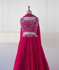 lehenga set  |womens lehenga choli |pink crop top lehenga set |designer lehenga dupatta | wedding lehenga choli | pink multi color lehenga usa Women's lehenga set /chinnon silk skirt/voggish /hot pink designer lehenga       lehengas are one of the beautiful and versatile traditional attires of india !! we carry such pieces in budget with great quality that can be styled in multiple ways with different outfits !!       Here is Beautiful hot pink color heavy gear soft chinnon silk lehenga with hand embroidery at the waist paired with matching pure raw silk heavy multicolor hand embroidered blouse  at the front and butis at the back as shown paired with same chinnon dupatta as shown !! Skirt has heavy gear and both pieces can be mix and matched with different outfits !! Ready to ship All over Hot Pink Mehndi Outfit, Pink Semi-stitched Art Silk Dress, Pink Long Skirt Sharara For Navratri, Pink Dola Silk Dress For Reception, Fitted Pink Choli With Dori Work, Pink Fitted Dori Work Choli, Festive Pink Sharara Long Skirt, Festive Pink Long Skirt Sharara, Pink Party Skirt With Traditional Drape