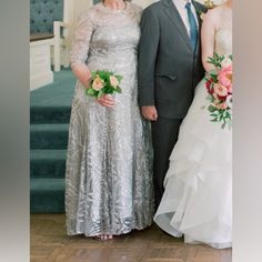 the bride and groom are standing next to each other