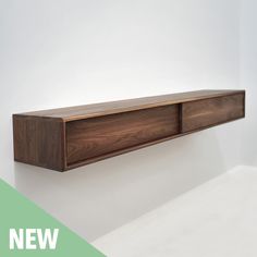 a wooden shelf mounted to the side of a wall