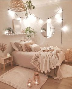 a bedroom with white walls and lights on the ceiling