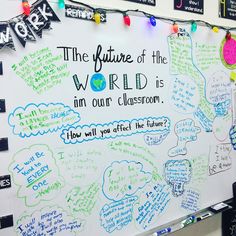 a white board with writing on it that says the future of the world is in our classroom