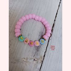 These fun handmade personalized bracelets for little girls are oh so adorable. Made of pink pony beads and designed to fit age toddler to 12 years old. Personalized Pink Charm Bracelet For Birthday, Customizable Pink Charm Bracelet For Birthday, Personalized Pink Charm Bracelet, Pink Bracelet Wristband For Birthday, Customizable Pink Charm Bracelet As Gift, Pink Wristband For Birthday, Cute Charm Bracelet With Letter Beads For Birthday, Cute Birthday Charm Bracelet With Letter Beads, Pink Beaded Name Bracelet For Birthday