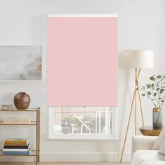 a pink roller blind in a living room