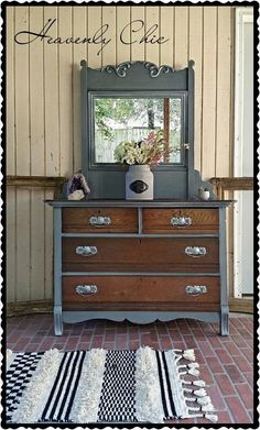 an old dresser with a mirror and rug on the floor