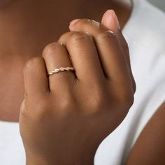 a close up of a person wearing a ring