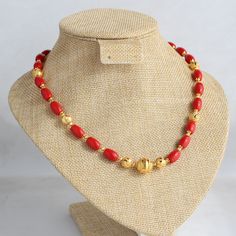 Crafted with coral-colored beads and gold-plated beads, this necklace boasts a handmade design, embodying a contemporary ethnic aesthetic. Vibrant and elegant, it radiates sophistication, seamlessly blending tradition and modern flair. Feel free to explore other options featuring coral and beads. As our exclusive design, we welcome customization requests--message us to make this piece uniquely yours. Length - 18 inch Beads Collection Gold, Coral Beads Necklace Indian Gold, Coral Gold Necklace, Coral Chain Designs, Elegant Red Coral Necklace With Gold Beads, Elegant Coral Jewelry With Gold Beads, Gold Beaded Necklaces With Red Coral Round Beads, Gold Beaded Necklace With Polished Red Coral, Elegant Red Coral Beaded Necklace With Gold Beads