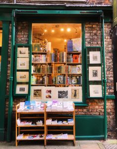 a store front with books on display in the window