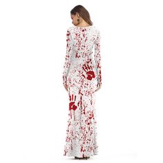 a woman in a white dress with red paint splattered all over her body