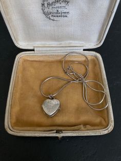 Beautiful 1970s VINTAGE SILVER Locket on a sterling silver 16 inch Chain. A lovely heart shaped Sterling Silver Engraved Pendant Necklace. 70s Vintage Silver Jewelry offered by Isobel Vintage Jewels on Etsy Style: Vintage 1970s real silver locket. A lovely heart 70s side opening sterling silver locket big enough for putting little photos inside.  Colour: silver  Size: 1.5 x 1.5 cm and 16 inch chain Condition: Excellent condition Approximate Date: 1970s Check out my other lovely silver items including this one: https://www.etsy.com/uk/listing/1269638336/70s-sterling-silver-ring-pretty-delicate Please note: ALL the items in my shop are vintage and have been previously worn. Items will show wear commensurate with their age and any major flaws will be noted and I really only sell items that ar Vintage Charm Heart Pendant Necklace For Anniversary, Anniversary Necklace With Vintage Charm And Heart Pendant, Vintage Necklace With Heart Charm As Gift, Vintage Necklace With Heart Charm, Vintage Heart Charm Necklace As Gift, Vintage Necklace With Heart Charm For Gift, Vintage Heart Charm Necklace For Valentine's Day, Vintage Necklace For Valentine's Day, Vintage Double Heart Charm Necklaces