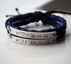 two personalized bracelets are shown with the date and year on them, one is for him or her