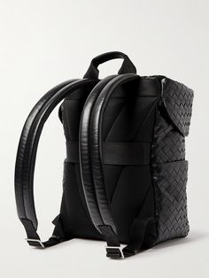 Beyond its artistic integrity, Bottega Veneta actually first devised its intrecciato weave to make leather stronger and more durable. This backpack is woven in a roomy, boxy shape and topped with a buckled lid. It's certainly sleek enough to work with tailoring and other smart outfits. Leather Travel Bag With Interwoven Design, Designer Woven Leather Travel Bag, Designer Travel Bag With Woven Leather, Luxury Leather Backpack With Leather Trim, Designer Leather Bags With Interwoven Design, Designer Travel Bags With Interwoven Design, Luxury Textured Leather Backpack, Travel Bags With Interwoven Design, Smart Outfits