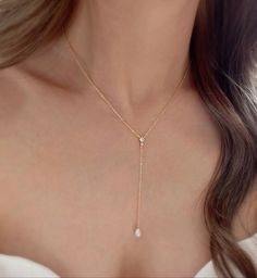 * DETAILS * (The drop on the necklace is 3 inches.) * Gold Plated Necklace  -Teardrop Shape Synthetic White Pearls - 18K Gold Plated Dainty Cable Chain - Gold plated CZ Paved Connector - 14k Gold Filled Spring Ring Clasp  👉🏻For more Y-necklaces, see https://www.etsy.com/shop/JinnysJewelryBySeJin * CARE TIPS * ⭐️TO PREVENT TARNISH: Keep your jewellery in airtight plastic bags. It won't tarnish if it isn't exposed to air. The worst place to leave your jewellery is in a steamy bathroom. Wipe with Dainty Pear-shaped Drop Necklace For Formal Events, Elegant Dangle Drop Necklace For Anniversary, Elegant Teardrop Backdrop Necklace With Adjustable Fit, White Drop Necklace With Delicate Dangle Chain, White Drop Lariat Necklace With Pearl Drop, Elegant Adjustable Teardrop Drop Necklace, White Teardrop Pendant Drop Necklace With Adjustable Chain, Elegant Teardrop Pendant Lariat Necklace For Wedding, White Delicate Dangle Drop Necklace