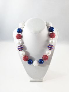 This necklace is made with the finest beads and is approximately 17inches long with a 2" adjustable extender!  Add a matching Spring headband for its final touch!  Perfect for Mommy and Baby!Chunky Bubblegum Necklaces are perfect for Gift Bags, Photo Props or if you just want that extra "wow" factor when accessorizing an outfit."LIKE" our Facebook page for Specials and check back often for NEW necklaces!www.facebook.com/wearecutiecouture Follow us on Instagram @wearecutiecouture{NOTE} This neckl Handmade Red Necklaces For Birthday, Handmade Red Necklace For Birthday, Adjustable Beaded Necklaces For Birthdays, Patriotic White Jewelry With Colorful Beads, Adjustable Colorful Beaded Jewelry For 4th Of July, Adjustable Blue Jewelry For 4th Of July, Patriotic Adjustable Colorful Beads Jewelry, Blue Patriotic Necklace For Gift, Patriotic Blue Necklace For Gift