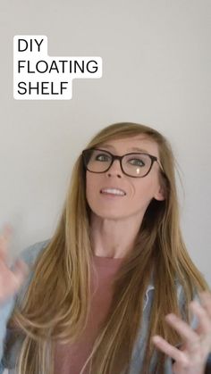 a woman with glasses is holding her hands up in front of her face and the words diy floating shelf above her head